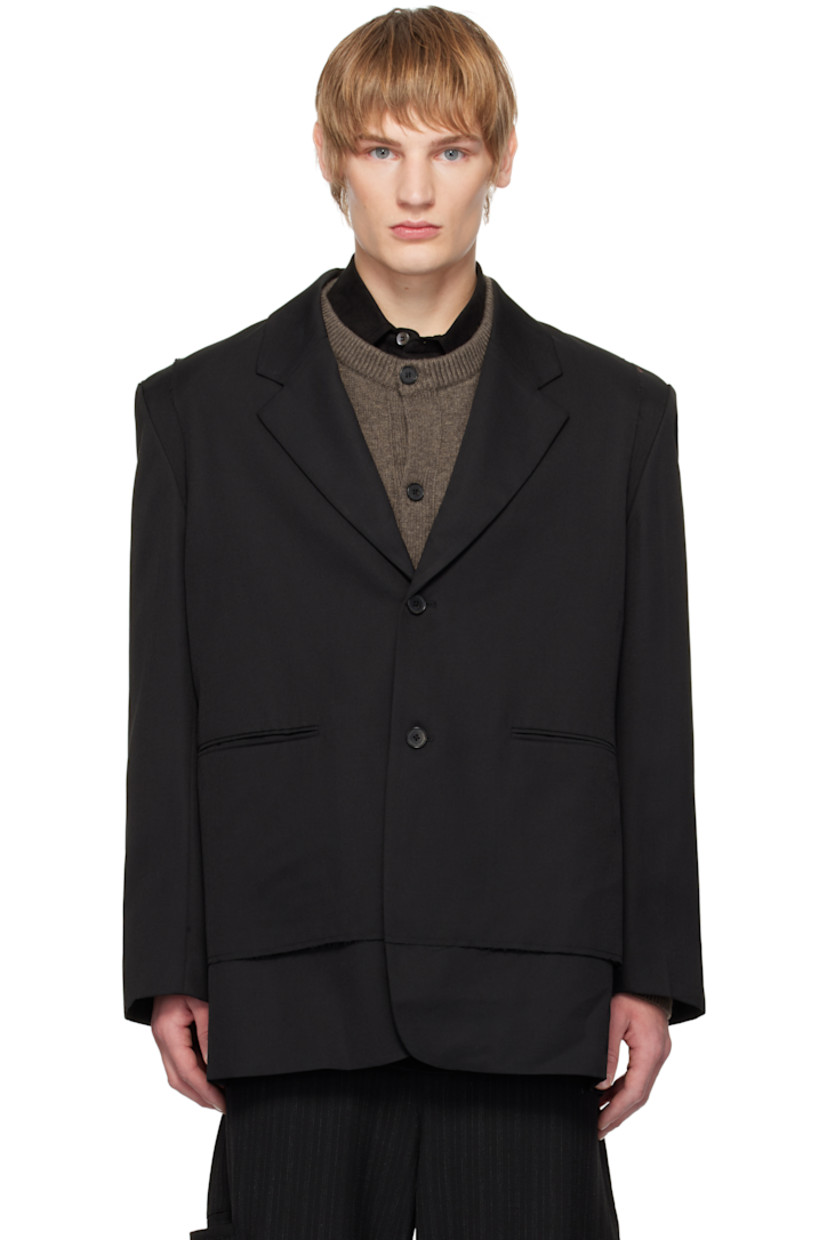 Worsted wool-blend twill blazer. Frayed edges throughout.

· Layered construction
· Notched lapel
· Button closure
· Welt pockets
· Four-button surgeon's cuffs
· Central vent at back hem
· Welt pocket at interior
· Full satin lining

Supplier color: Black