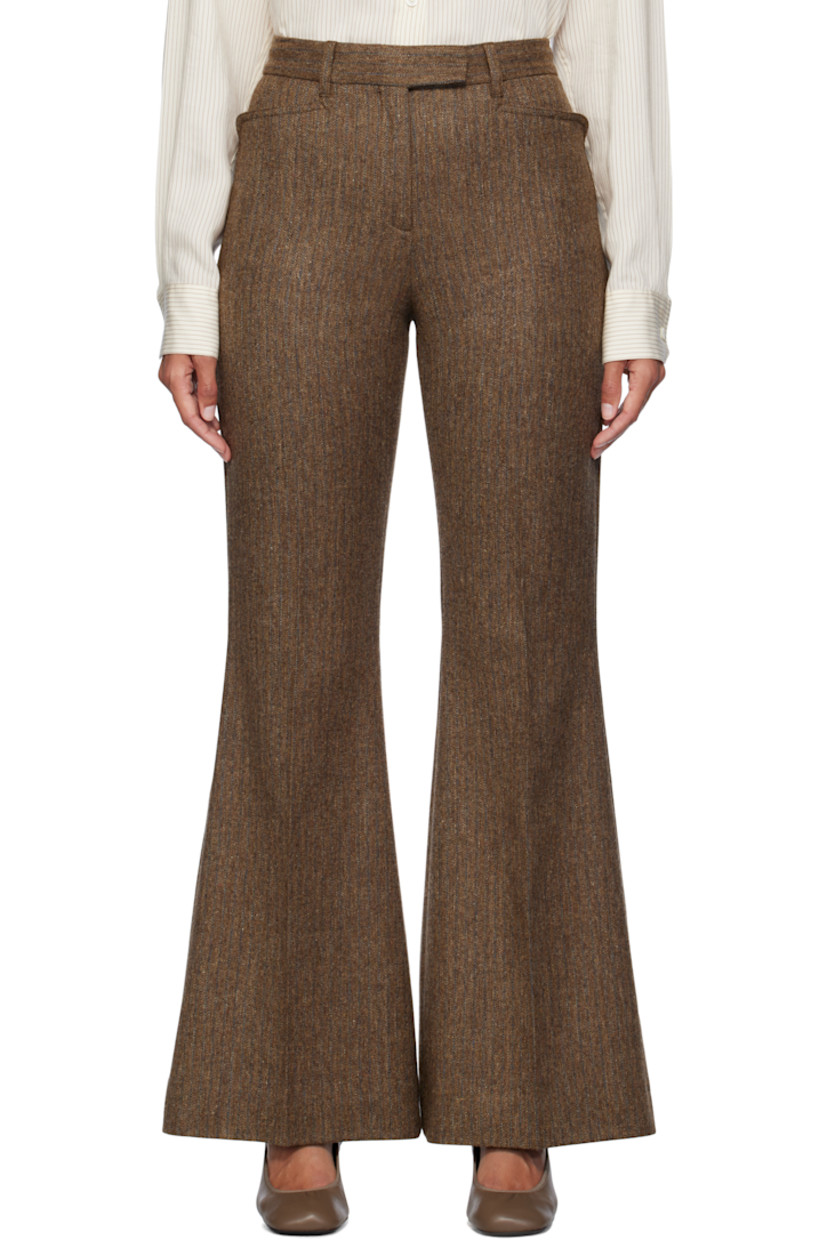 Flared merino wool tweed trousers. Herringbone pattern throughout.

· Belt loops
· Four-pocket styling
· Zip-fly
· Creased legs
· Unfinished hem
· Partial stretch satin lining

Supplier color: Carafe brown