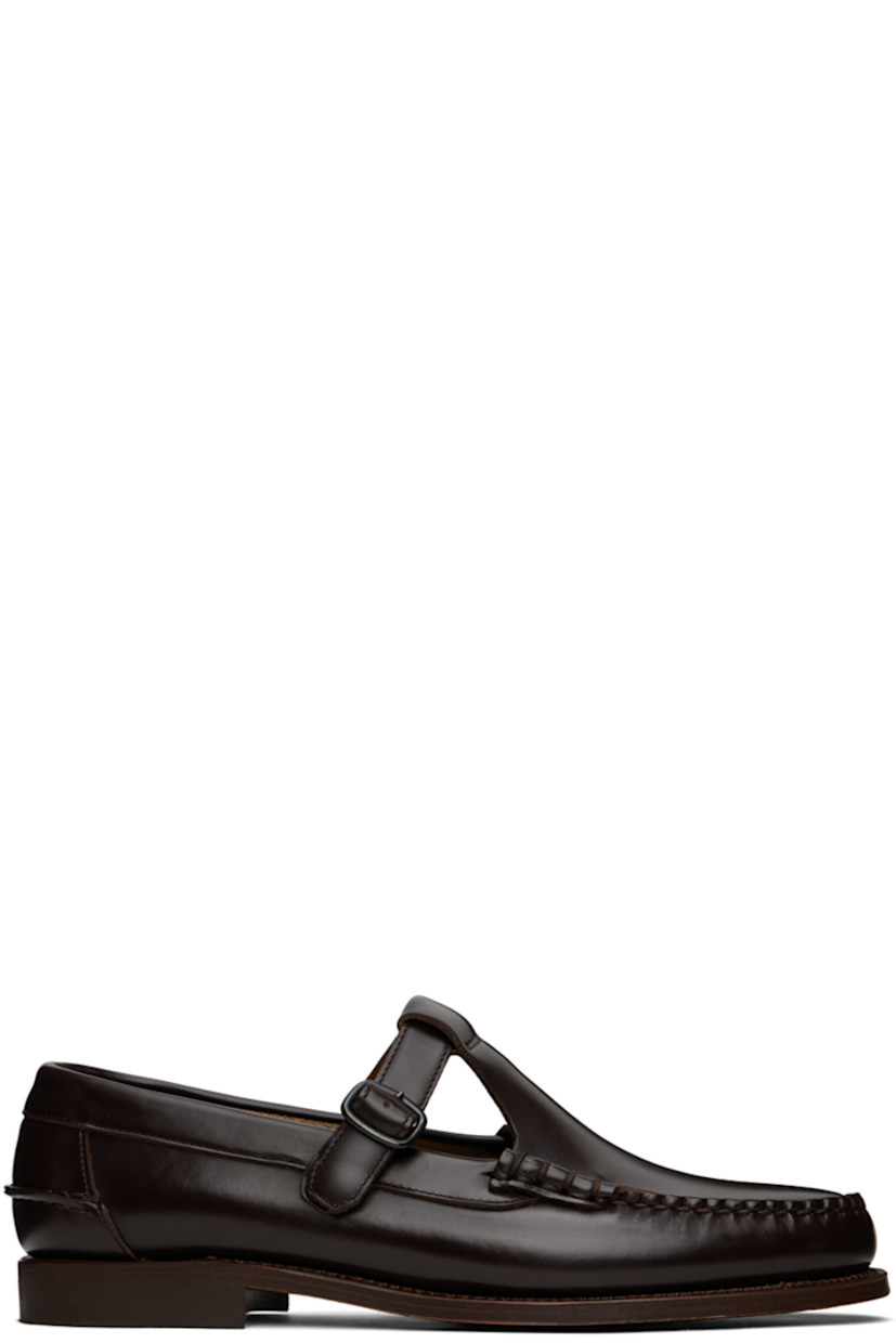 Handcrafted polished calfskin loafers in brown.

· Hand-sewn detailing at moc toe
· Pin-buckle strap at vamp
· Pinched seam at heel counter
· Logo-embossed padded leather footbed
· Suede lining
· Rubber block heel
· Leather sole
· Heel: H1"

Supplier color: Dark brown
