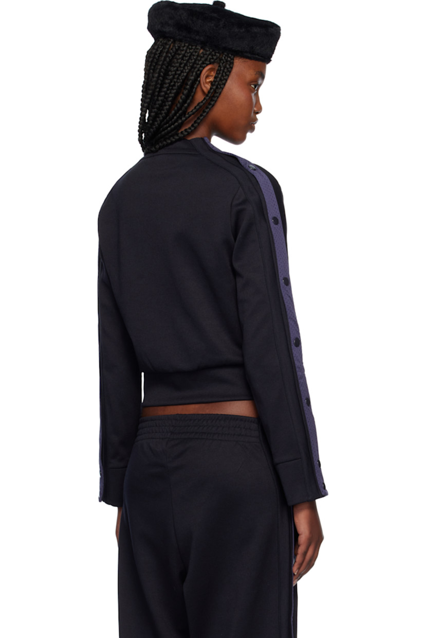 Polyester- and cotton-blend interlock jersey track jacket.

· Rib-knit stand collar, hem, and cuffs
· Zip closure
· Logo graphic printed at chest
· Zip pockets
· Mesh trim and press-stud vent at sleeves

Supplier color: Navy