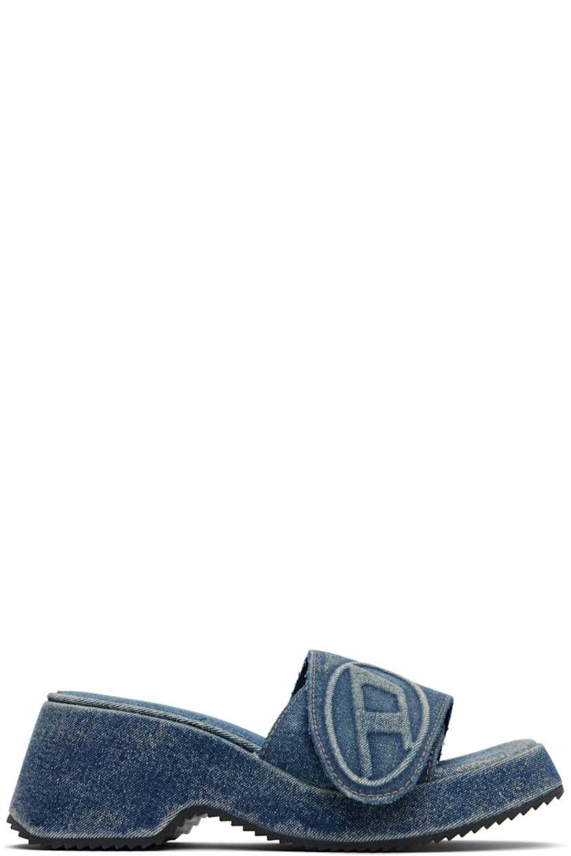 Denim slip-on heeled sandals in blue.

· Fading throughout
· Open toe
· Logo-embossed velcro strap at vamp
· Padded footbed
· Covered block heel midsole
· Treaded rubber sole
· Heel: H2.5"

Supplier color: Blue