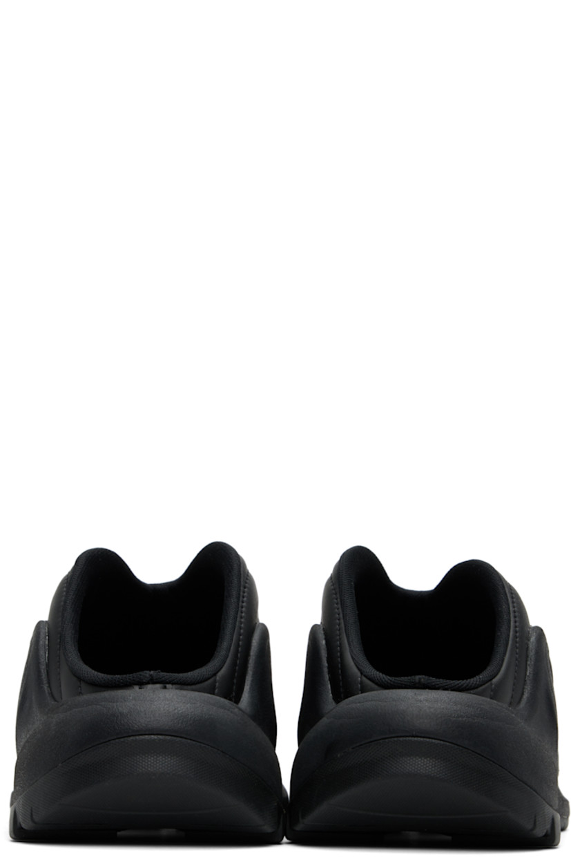 Low-top buffed faux-leather slip-on sneakers in black.

· Quilted and padded
· Mesh lining
· Logo embossed at foam rubber midsole
· Treaded rubber sole

Supplier color: Black