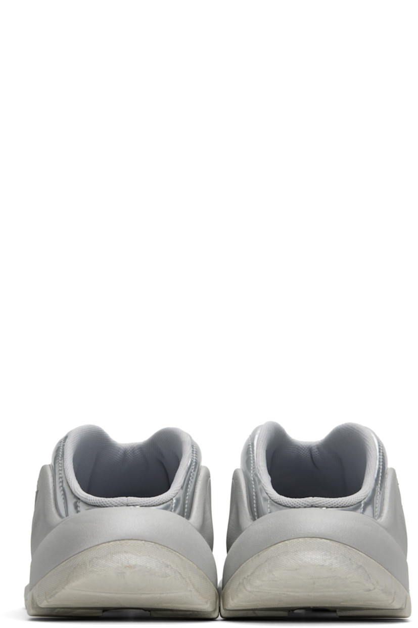 Low-top patent faux-leather slip-on sneakers in silver tone.

· Quilted and padded
· Mesh lining
· Logo embossed at foam rubber midsole
· Treaded rubber sole

Supplier color: Silver