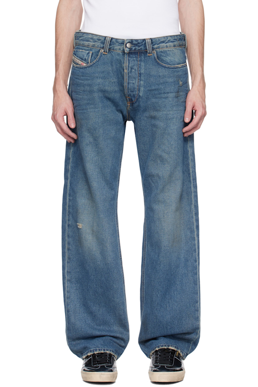 Straight-leg non-stretch denim jeans. Fading, whiskering, and distressing throughout. 

· Mid-rise
· Belt loops 
· Five-pocket styling 
· Button fly 
· Logo patch at coin pocket 
· Jacron patch at back waistband 
· Logo-engraved gunmetal-tone hardware

Supplier color: Medium blue