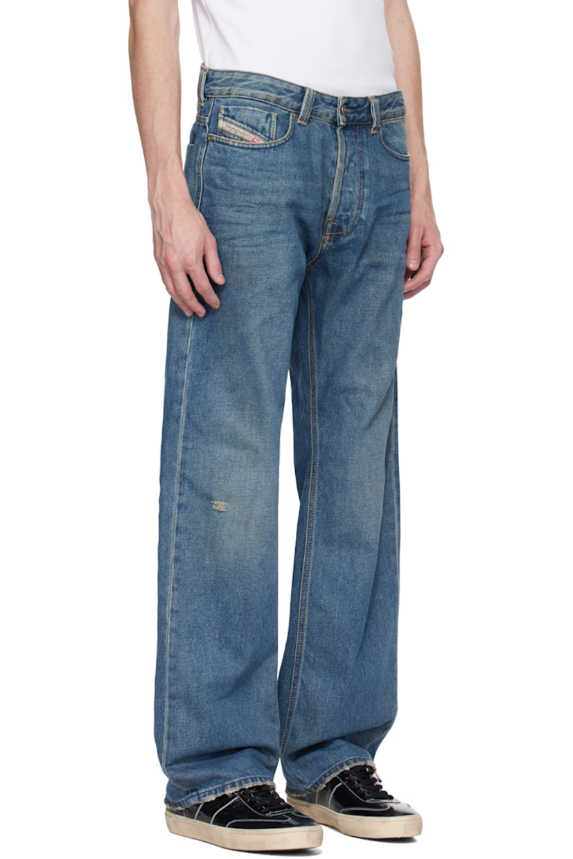 Straight-leg non-stretch denim jeans. Fading, whiskering, and distressing throughout. 

· Mid-rise
· Belt loops 
· Five-pocket styling 
· Button fly 
· Logo patch at coin pocket 
· Jacron patch at back waistband 
· Logo-engraved gunmetal-tone hardware

Supplier color: Medium blue