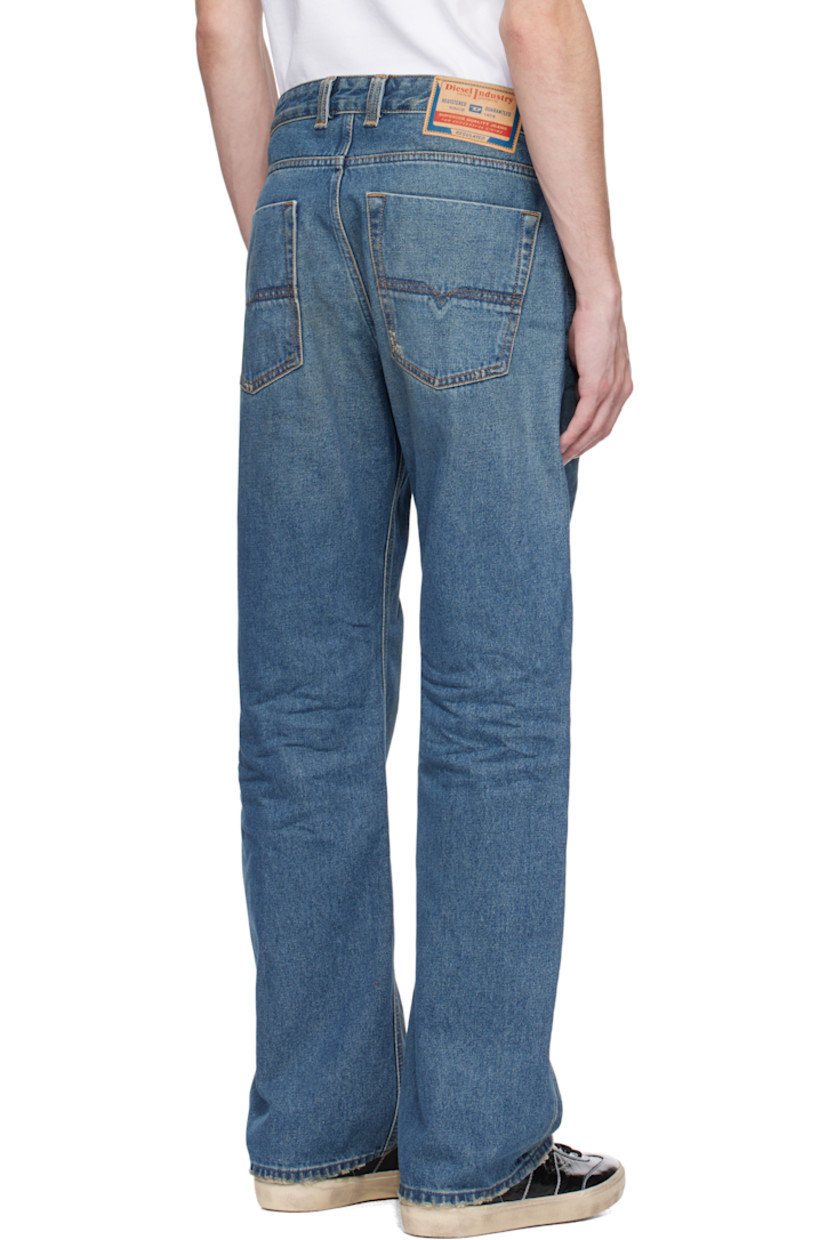 Straight-leg non-stretch denim jeans. Fading, whiskering, and distressing throughout. 

· Mid-rise
· Belt loops 
· Five-pocket styling 
· Button fly 
· Logo patch at coin pocket 
· Jacron patch at back waistband 
· Logo-engraved gunmetal-tone hardware

Supplier color: Medium blue