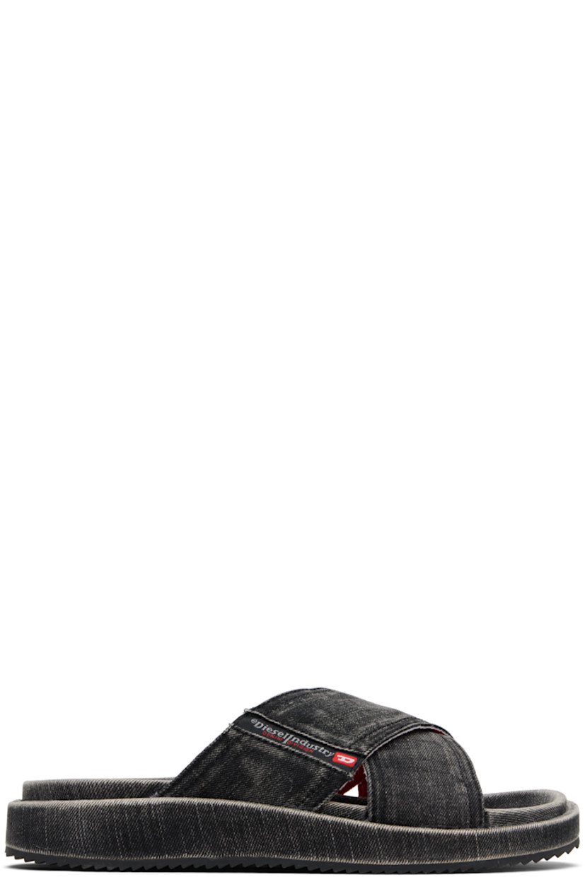Denim slip-on sandals in black.

· Fading throughout
· Open toe
· Crisscrossing straps at vamp
· Inset logo patch at strap
· Logo graphic printed at molded footbed
· Covered midsole
· Treaded rubber sole

Supplier color: Black