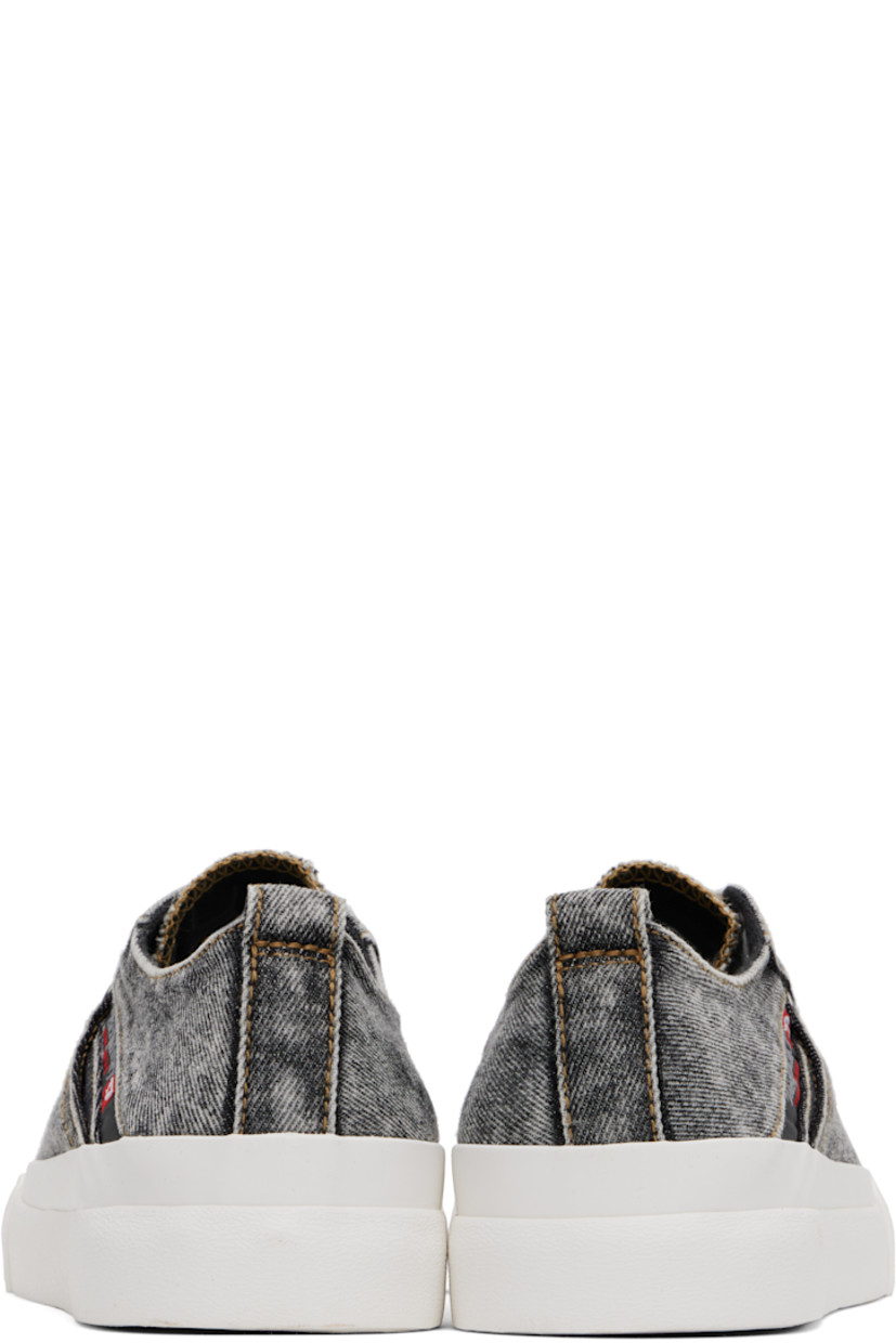 Low-top denim sneakers in gray and white.

· Fading throughout
· Rubber cap toe
· Lace-up closure
· Logo patch at tongue and outer side
· Pull-loop at heel collar
· Welt pocket at outer side
· Cotton canvas lining
· Logo patch at textured rubber midsole
· Treaded rubber sole

Supplier color: Black