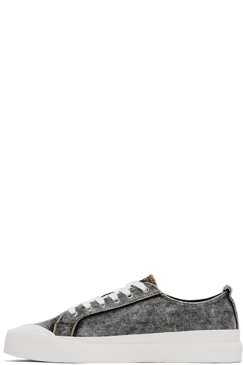 Low-top denim sneakers in gray and white.

· Fading throughout
· Rubber cap toe
· Lace-up closure
· Logo patch at tongue and outer side
· Pull-loop at heel collar
· Welt pocket at outer side
· Cotton canvas lining
· Logo patch at textured rubber midsole
· Treaded rubber sole

Supplier color: Black