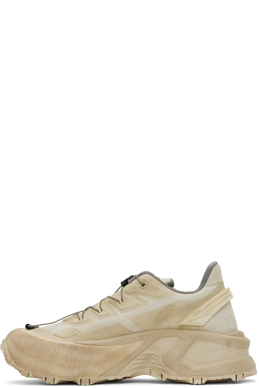 Low-top coated ripstop sneakers in beige.

· Fading and bonded trim throughout
· Cord-lock lace-up closure
· Logo bonded at padded tongue
· Padded collar
· Rubberized pull-loop at heel counter
· Jersey and mesh lining
· Logo embossed at platform midsole
· Treaded rubber sole
· Platform: H2"

Supplier color: Beige