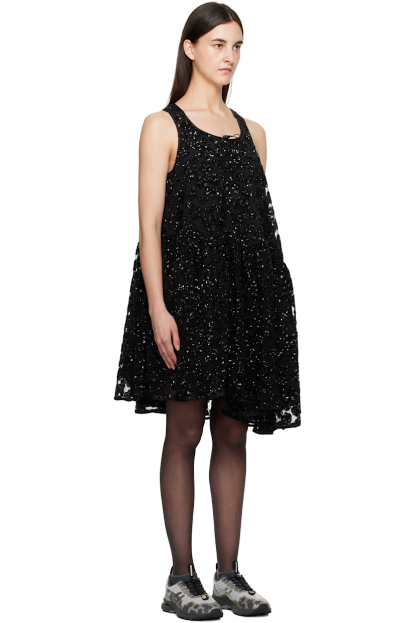 Polyester tulle minidress. Sequinned floral appliqués throughout.

· Bungee-style drawstring at scoop neck
· Gathering at waist
· Asymmetrical hem
· Full silk-blend crêpe lining

Supplier color: Black