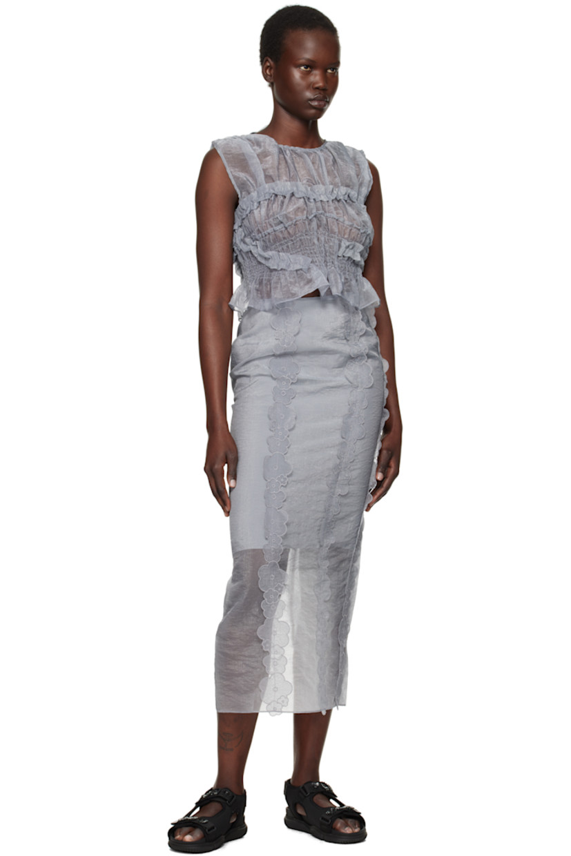 Sheer crinkled nylon- and polyester-blend organza midi skirt.

· Embroidered floral appliqués at front
· Concealed zip closure at back waist
· Slit at back hem
· Partial crepe lining

Supplier color: Grey