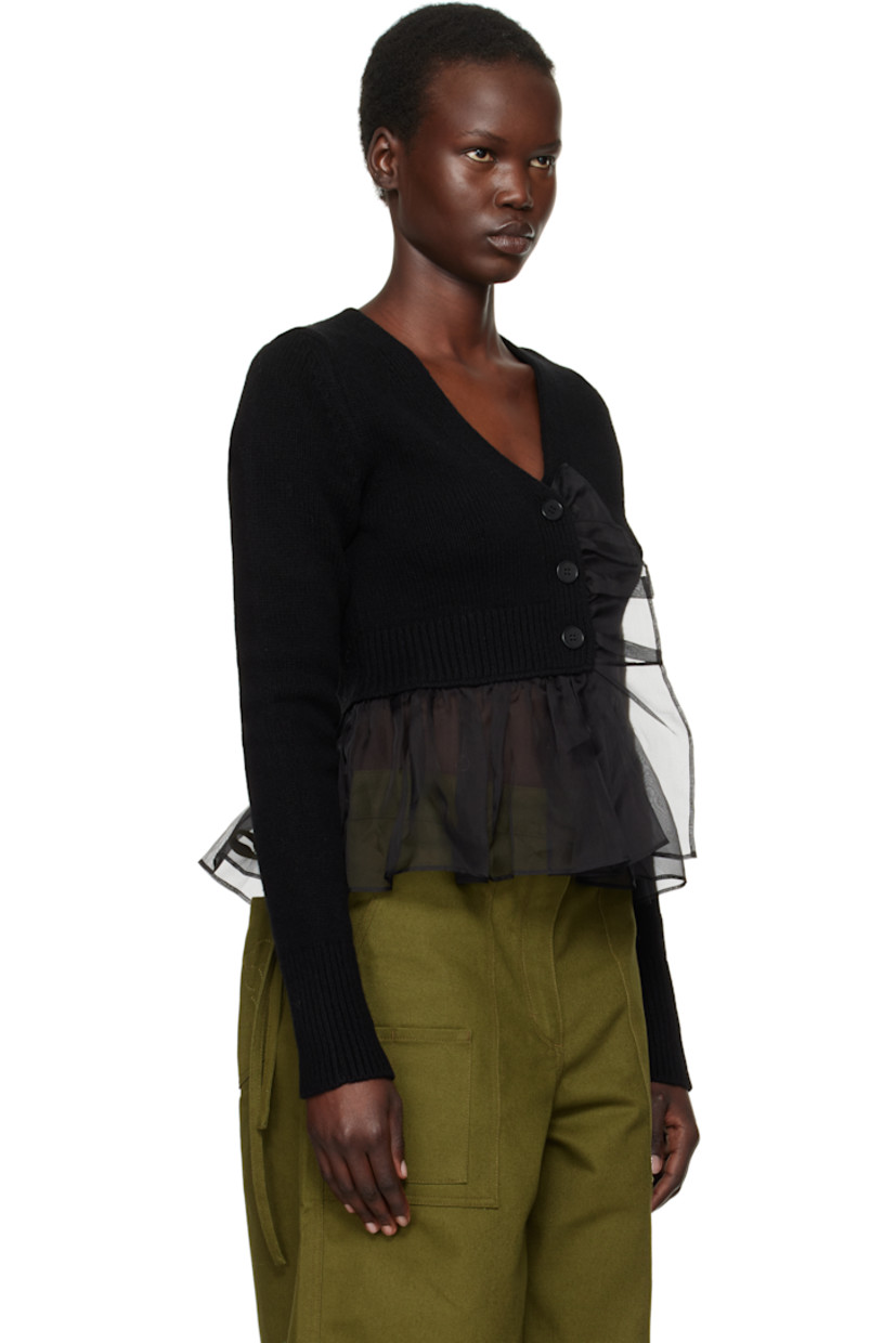 Knit cashmere- and wool-blend cardigan. Sheer silk organza trim at placket and peplum hem.

· Rib-knit V-neck, placket, hem, and cuffs
· Button closure
· Cropped hem

Supplier color: Black