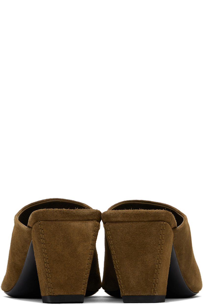 Calfskin suede mules in brown.

· Pointed toe
· Grained goatskin lining
· Covered block heel with rubber injection
· Leather sole
· Heel: 2.25"

Supplier color: Camel