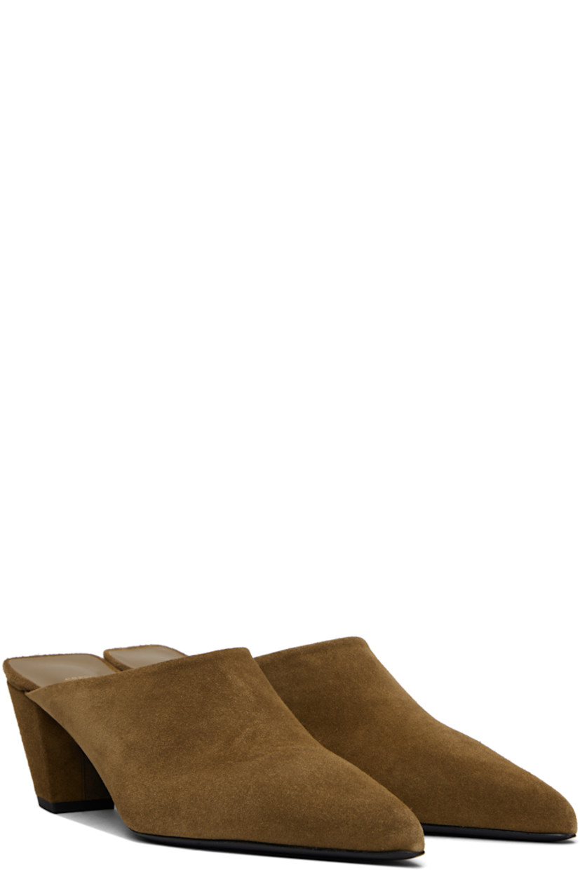 Calfskin suede mules in brown.

· Pointed toe
· Grained goatskin lining
· Covered block heel with rubber injection
· Leather sole
· Heel: 2.25"

Supplier color: Camel