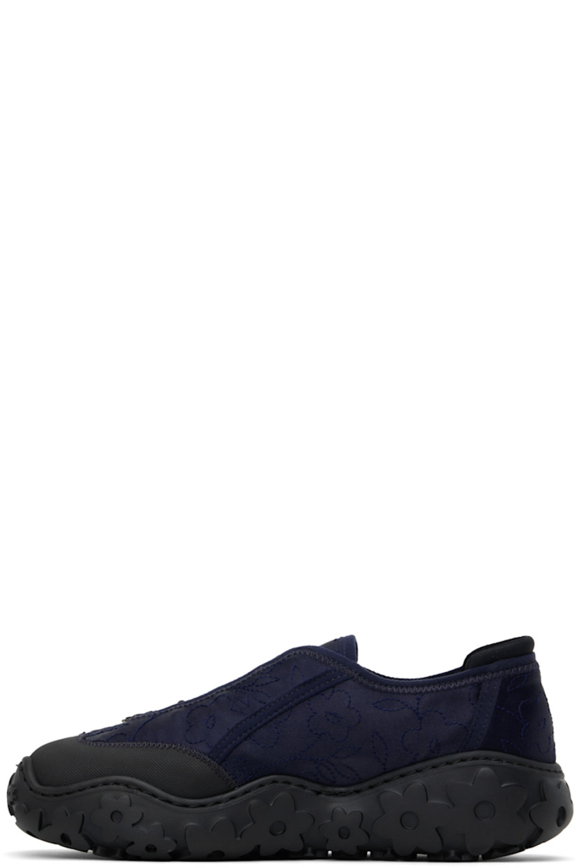 Low-top satin sneakers in navy.

· Positive Luxury Butterfly Mark-certified
· Floral pattern embroidered throughout
· Textured rubber cap toe
· Floral appliqués at toggle closure 
· Bonded jersey trim at heel collar
· Logo patch at footbed
· Microfibre lining
· Floral pattern embossed at rubber sole

Supplier color: Dark blue