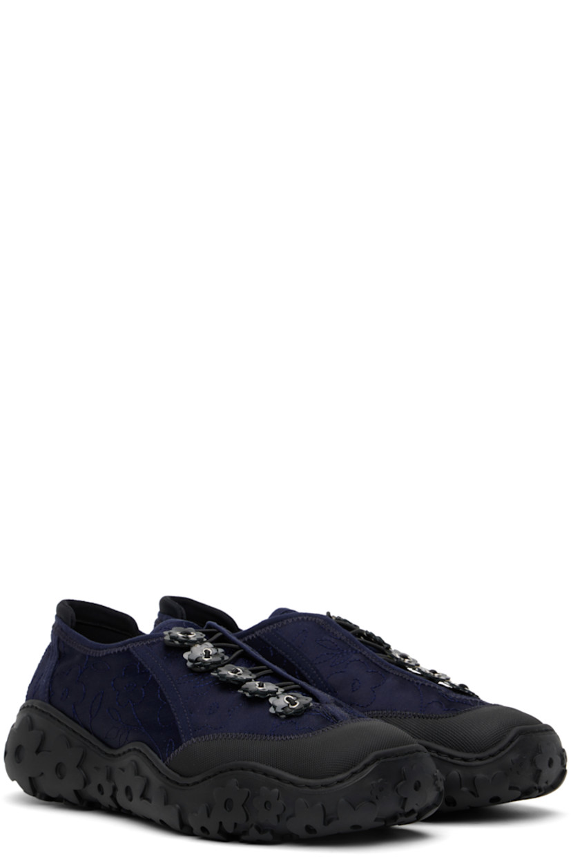 Low-top satin sneakers in navy.

· Positive Luxury Butterfly Mark-certified
· Floral pattern embroidered throughout
· Textured rubber cap toe
· Floral appliqués at toggle closure 
· Bonded jersey trim at heel collar
· Logo patch at footbed
· Microfibre lining
· Floral pattern embossed at rubber sole

Supplier color: Dark blue