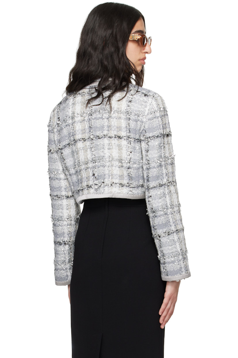 Viscose-blend tweed jacket. Metallic threads and satin trim throughout.

· Frayed edge at round neck
· Button closure
· Padded shoulders
· Full stretch silk satin lining

Supplier color: Quadri check