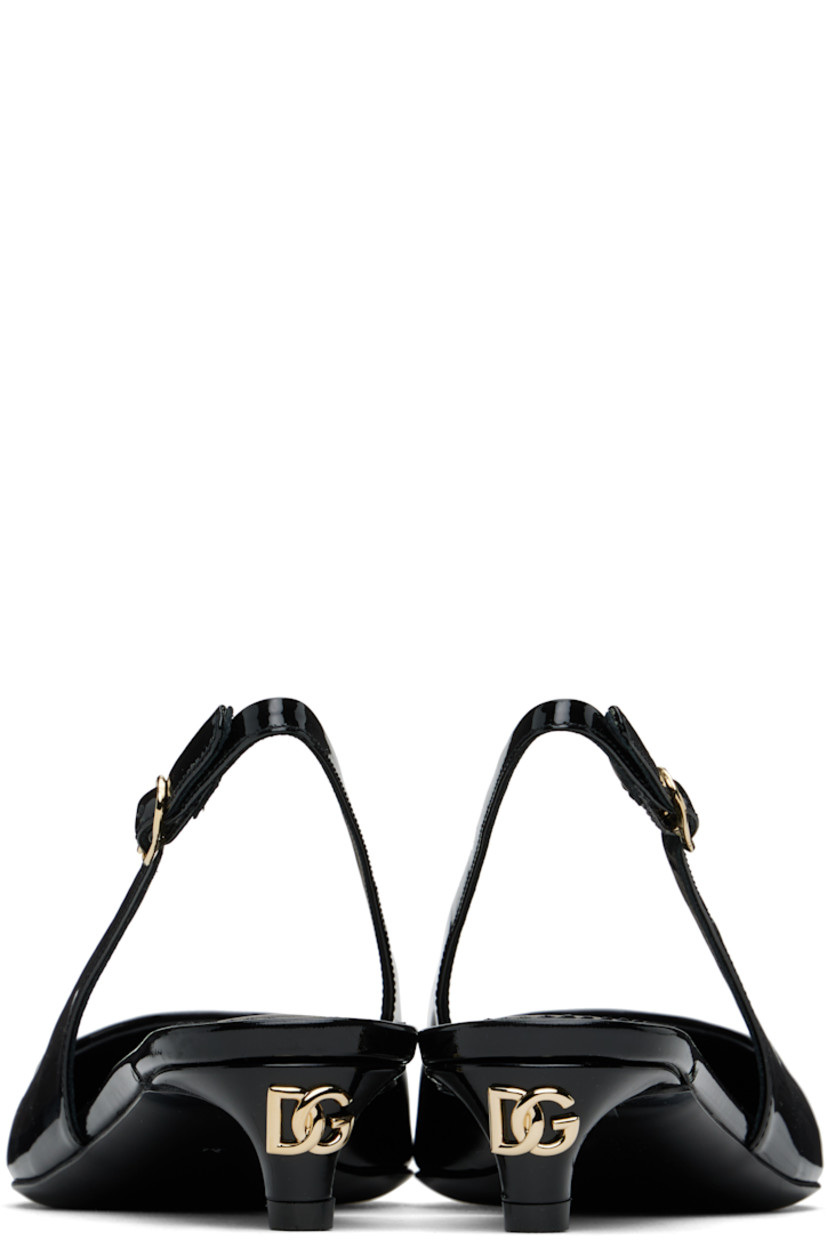 Patent leather heels in black.

· Pointed toe
· Pin-buckle slingback strap
· Gold-tone logo hardware at heel
· Logo patch at padded leather footbed
· Covered kitten heel with rubber injection
· Leather sole with rubber injection
· Heel: H1.25"

Supplier color: Nero