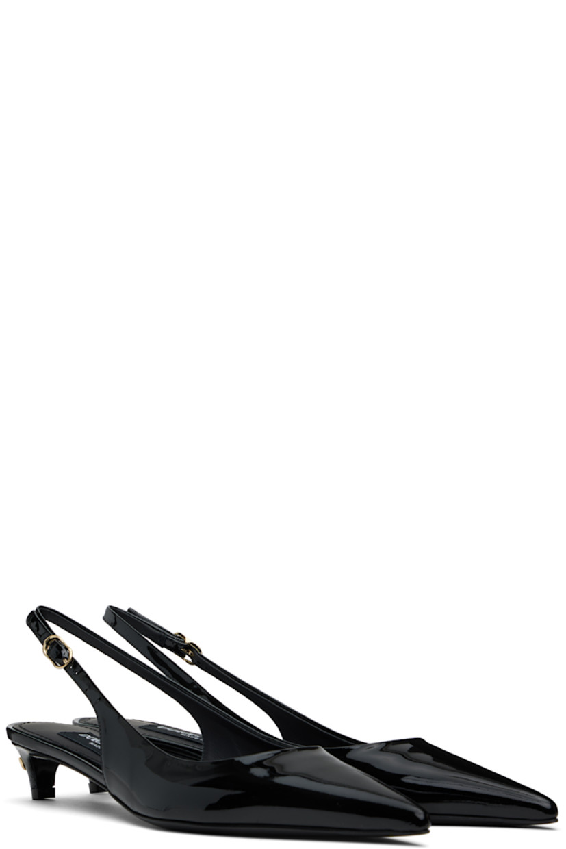 Patent leather heels in black.

· Pointed toe
· Pin-buckle slingback strap
· Gold-tone logo hardware at heel
· Logo patch at padded leather footbed
· Covered kitten heel with rubber injection
· Leather sole with rubber injection
· Heel: H1.25"

Supplier color: Nero