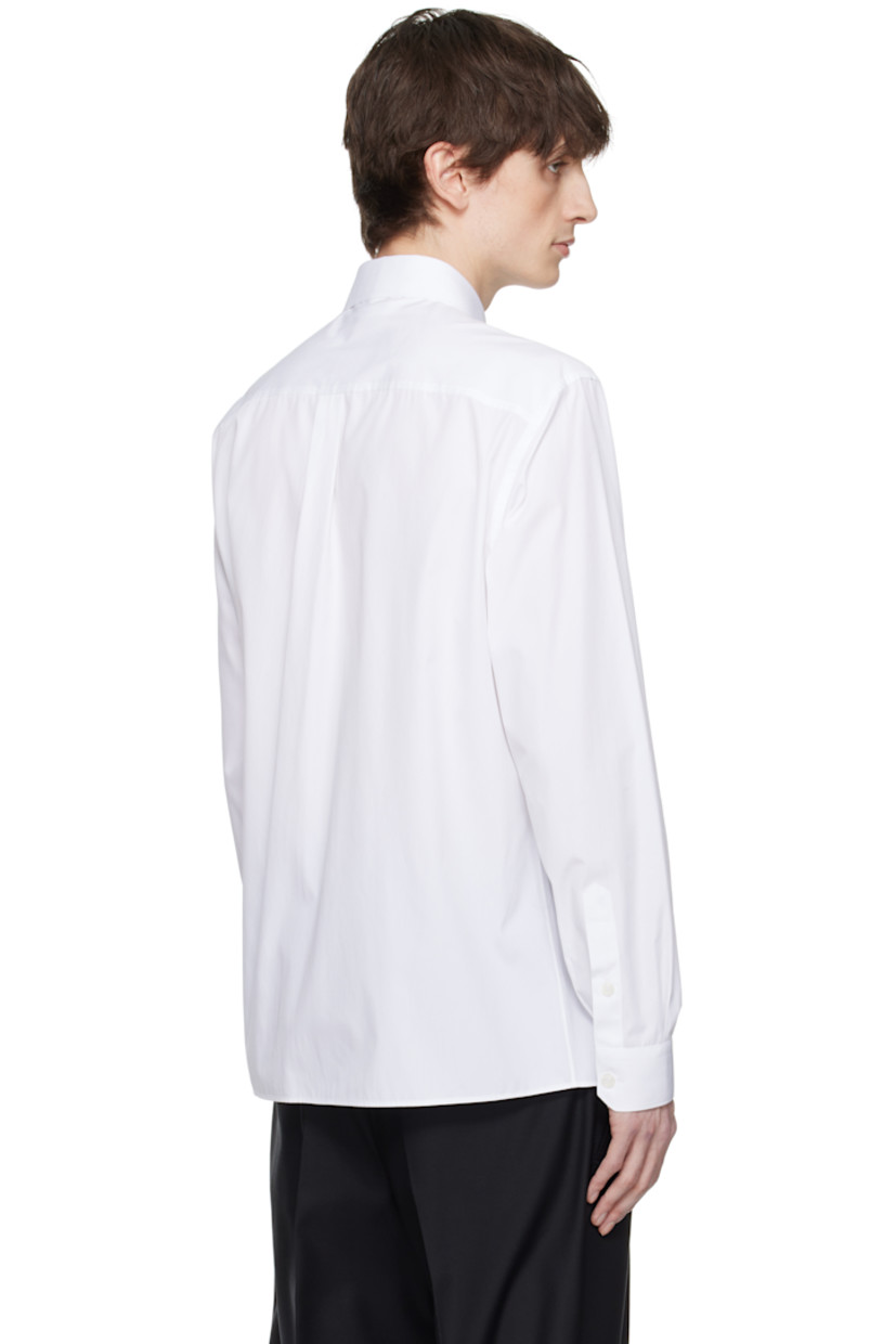 Cotton poplin shirt.

· Spread collar
· Button closure
· Patch pocket 
· Logo plaque with leather trim at chest
· Pleats at single-button barrel cuffs
· Box pleat at back yoke

Part of the Essential collection

Supplier color: Bianco ottico
