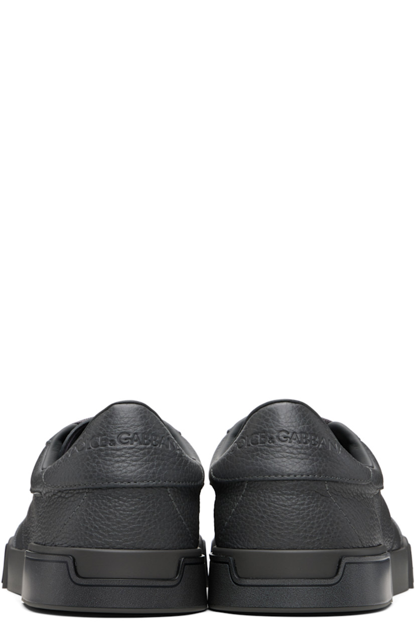 Low-top grained calfskin sneakers. 

· Lace-up closure
· Padded tongue and collar
· Logo embossed at tongue and heel tab
· Lambskin and goatskin lining
· Logo embossed at midsole 
· Treaded rubber sole 

Supplier color: Grigio/Nero