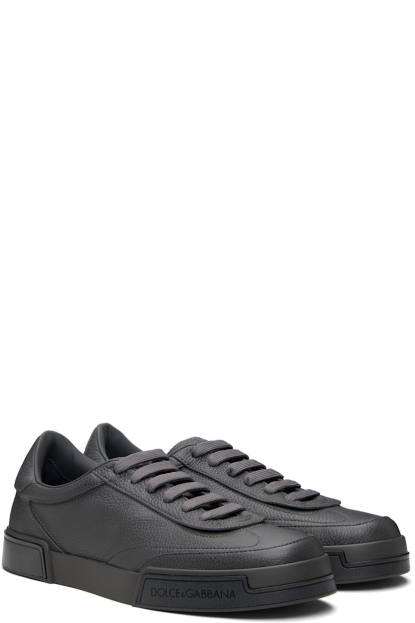 Low-top grained calfskin sneakers. 

· Lace-up closure
· Padded tongue and collar
· Logo embossed at tongue and heel tab
· Lambskin and goatskin lining
· Logo embossed at midsole 
· Treaded rubber sole 

Supplier color: Grigio/Nero