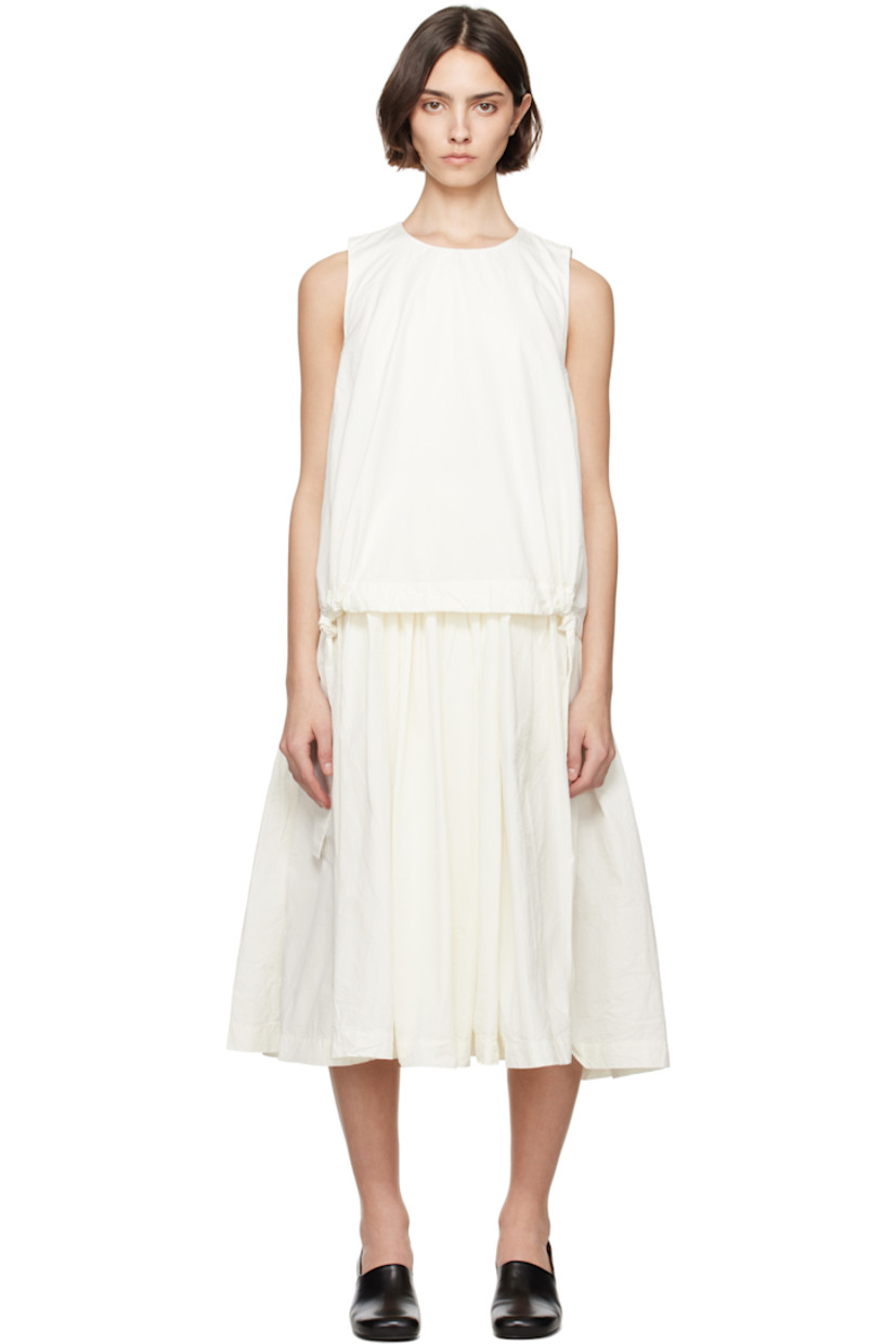 Crinkled cotton poplin midi dress.

· Layered construction
· Round neck
· Drawstrings at layered hem 
· Gathering at waist and armscyes
· Seam pockets at waist
· Button fastening at back collar
· Corozo hardware

Supplier color: Off-White