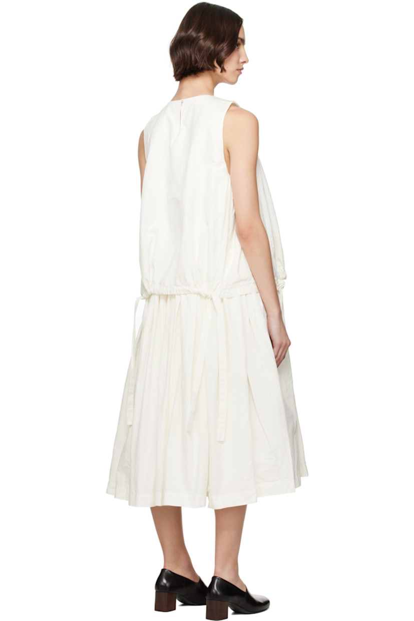 Crinkled cotton poplin midi dress.

· Layered construction
· Round neck
· Drawstrings at layered hem 
· Gathering at waist and armscyes
· Seam pockets at waist
· Button fastening at back collar
· Corozo hardware

Supplier color: Off-White