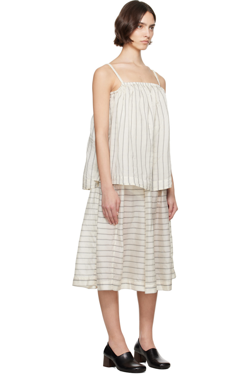 Silk organza midi dress. Stripes throughout

· Layered construction
· Elasticized straight neck
· Gathering at waist
· Seam pockets at waist
· Flared skirt
· Elasticized spaghetti straps
· Self-tie straps at back

Supplier color: Spider stripes as is