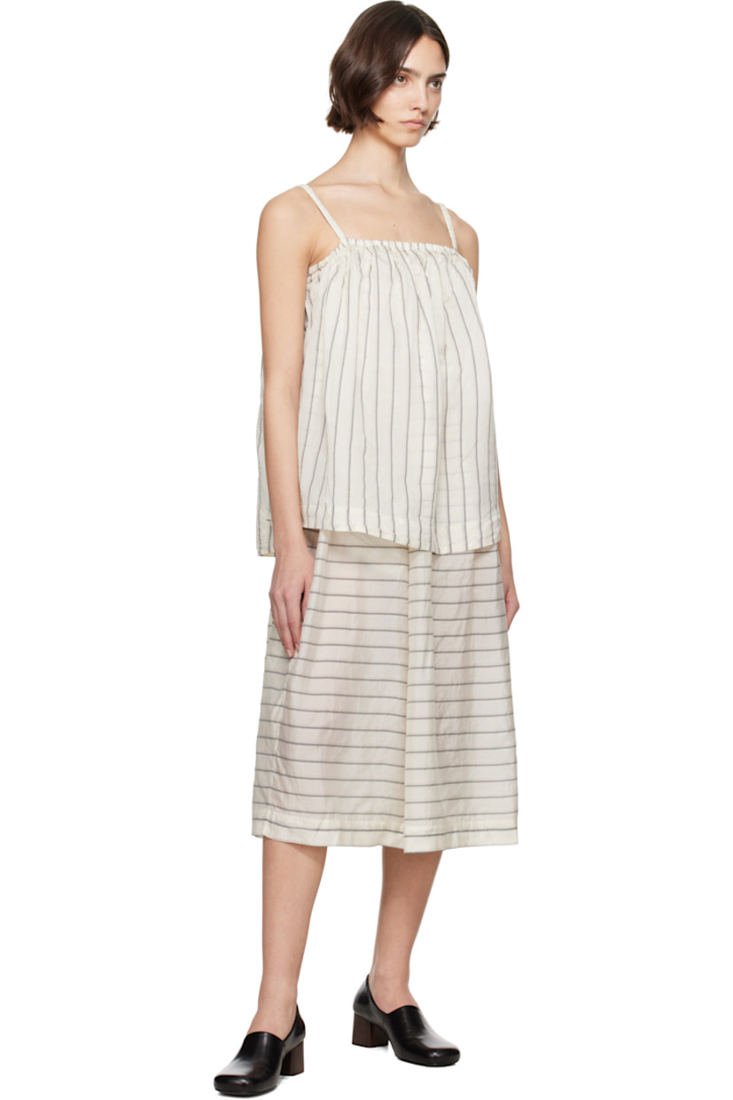 Silk organza midi dress. Stripes throughout

· Layered construction
· Elasticized straight neck
· Gathering at waist
· Seam pockets at waist
· Flared skirt
· Elasticized spaghetti straps
· Self-tie straps at back

Supplier color: Spider stripes as is