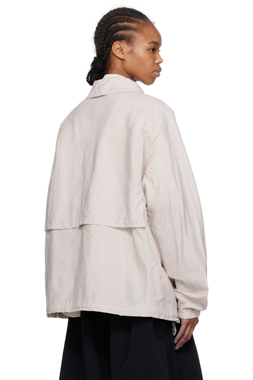 Waxed cotton broadcloth jacket.

· Spread collar
· Button closure
· Seam pockets
· Concealed drawstrings at hem
· Dolman sleeves
· Elasticized cuffs
· Storm flap at back
· Unlined 
· Corozo hardware

Supplier color: Concrete