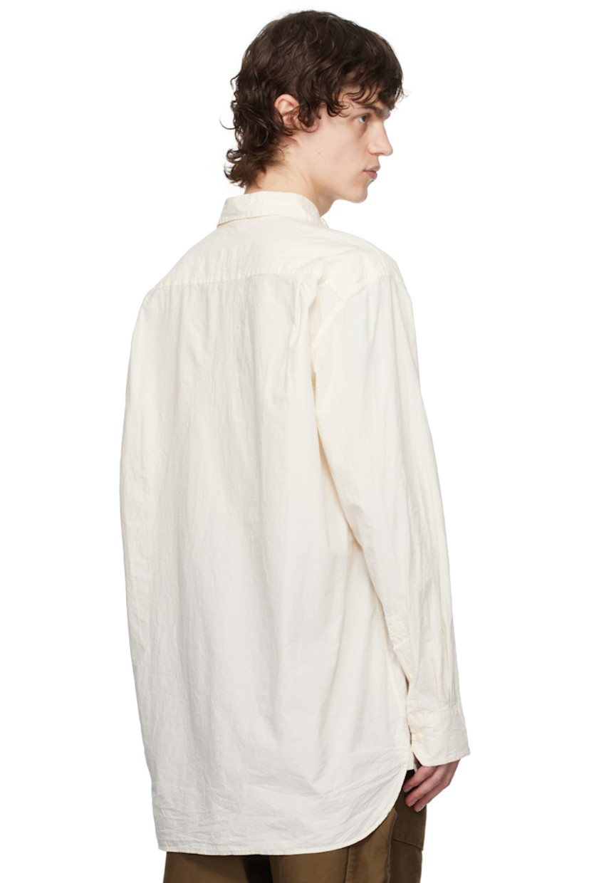 Crinkled cotton poplin shirt.

· Spread collar
· Button closure
· Curved hem
· Single-button barrel cuffs
· Corozo hardware

Supplier color: Natural