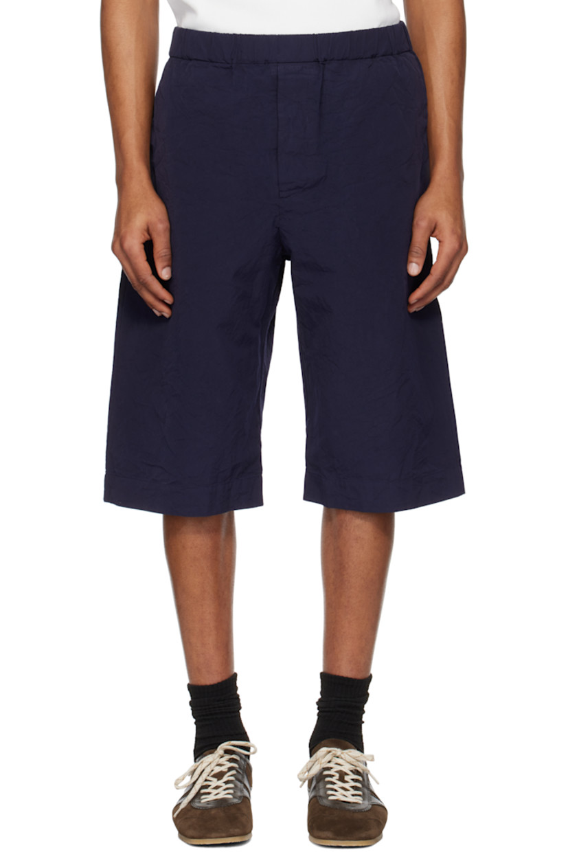 Crinkled cotton canvas shorts.

· Concealed drawstring at elasticized waistband
· Three-pocket styling
· Button fly
· Red stitch at back waistband
· Corozo hardware

Supplier color: Navy