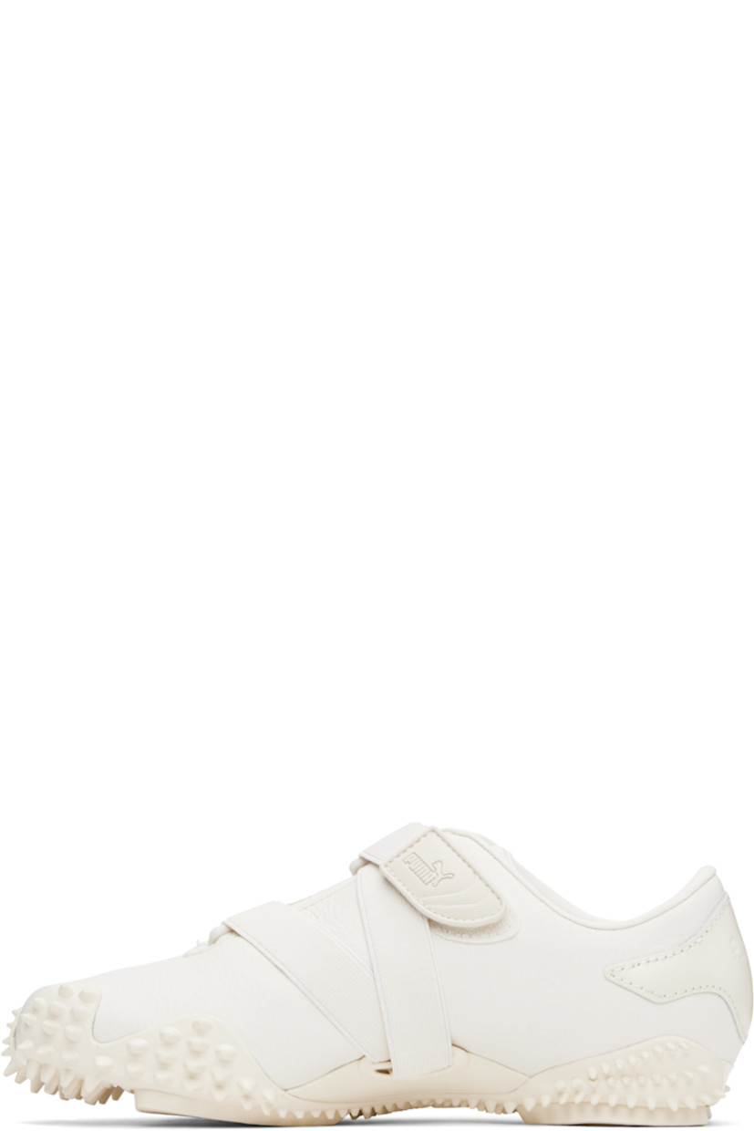 Low-top grained leather sneakers in white.

· Logo patch at offset velcro strap
· Logo patch and elasticized gusset at tongue
· Quilted Formstrip at outer side
· Logo embossed at heel counter
· Cushioned OrthoLite® footbed
· Grained faux-leather lining
· Spikes at rubber midsole
· Treaded rubber sole

Supplier color: Frosted ivory