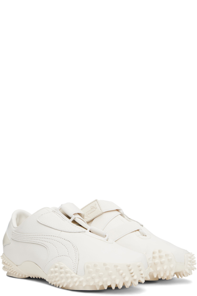 Low-top grained leather sneakers in white.

· Logo patch at offset velcro strap
· Logo patch and elasticized gusset at tongue
· Quilted Formstrip at outer side
· Logo embossed at heel counter
· Cushioned OrthoLite® footbed
· Grained faux-leather lining
· Spikes at rubber midsole
· Treaded rubber sole

Supplier color: Frosted ivory