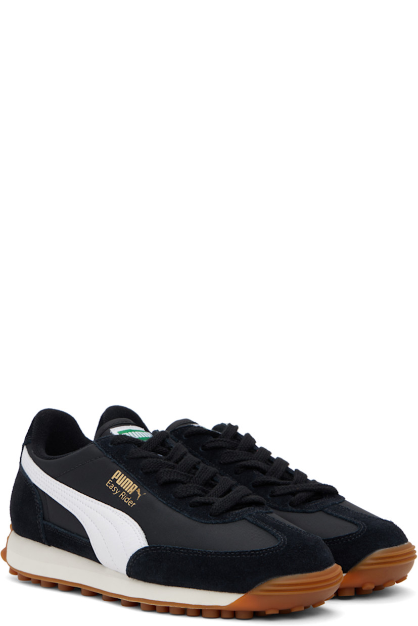 Low-top paneled canvas and LWG-certified suede sneakers in black and white.

· Lace-up closure
· Logo patch at tongue
· Padded collar
· Buffed leather Formstrip at sides
· Logo stamp at outer side and heel tab 
· Terrycloth lining
· Foam rubber midsole
· Treaded rubber sole

Supplier color: Puma black/Puma white