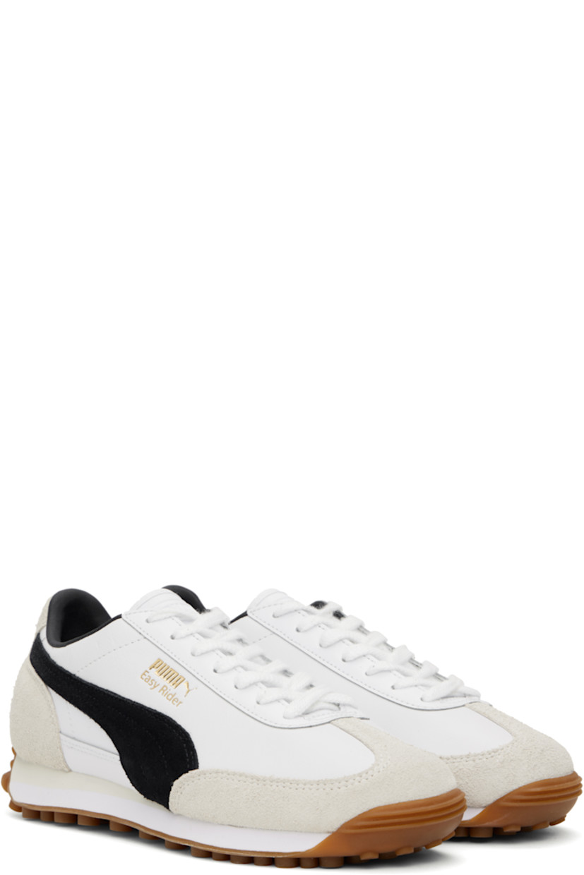 Low-top LWG-certified grained leather sneakers in white and black.

· Faux-suede trim at toe and heel
· Lace-up closure
· Logo embossed at tongue
· Padded collar
· Suede Formstrip at sides
· Logo stamp at outer side and heel tab
· Faux-leather lining
· Foam rubber midsole
· Treaded rubber sole

Supplier color: PUMA white/PUMA black