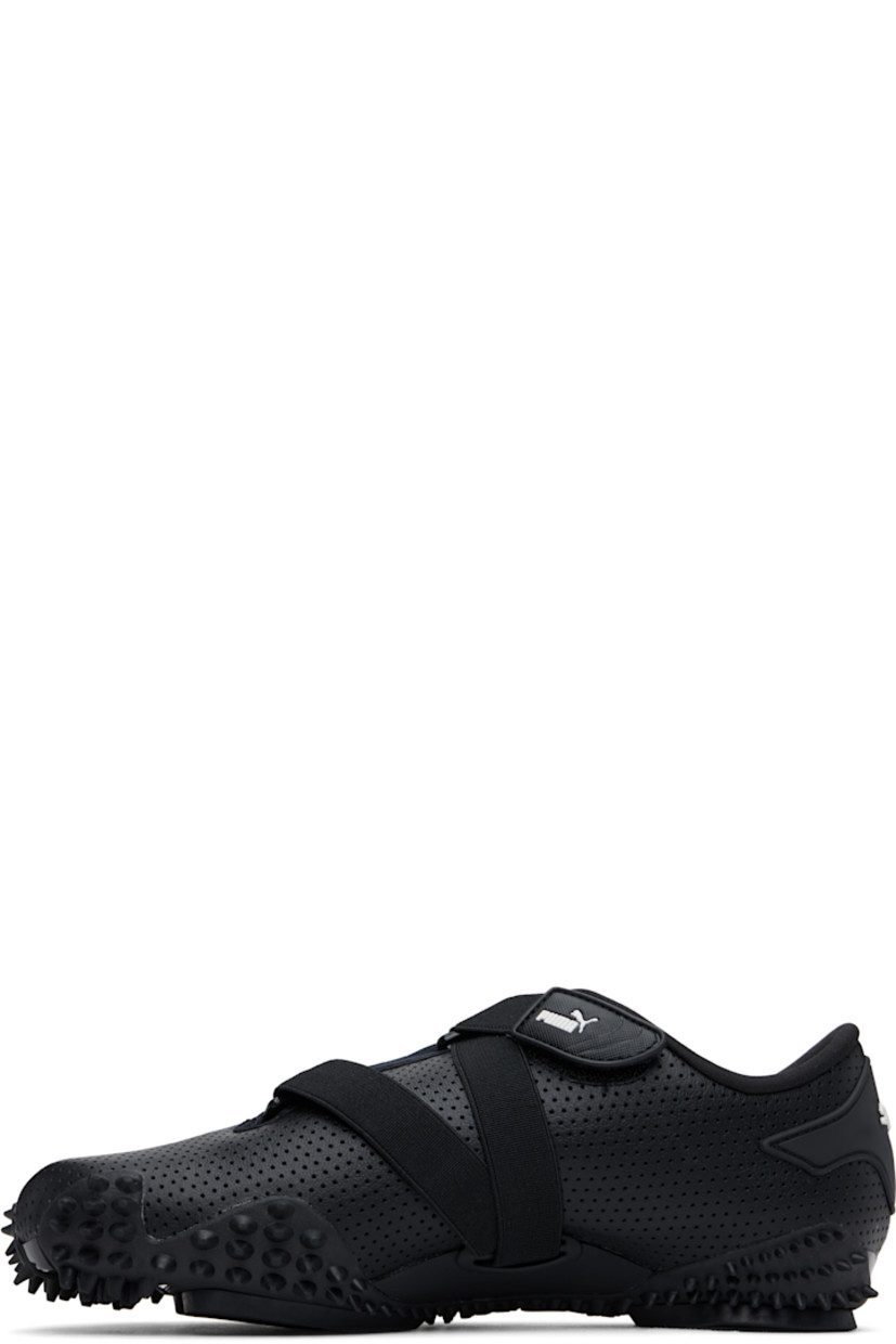 Low-top grained leather sneakers in black. 

· Perforations throughout
· Logo patch at offset velcro strap
· Logo patch and elasticized gusset at tongue
· Padded tongue and collar
· Quilted Formstrip at outer side
· Rubberized logo patch at heel counter
· Cushioned OrthoLite® footbed
· Jersey lining
· Spikes at rubber midsole
· Treaded rubber sole

Supplier color: PUMA black/PUMA white
