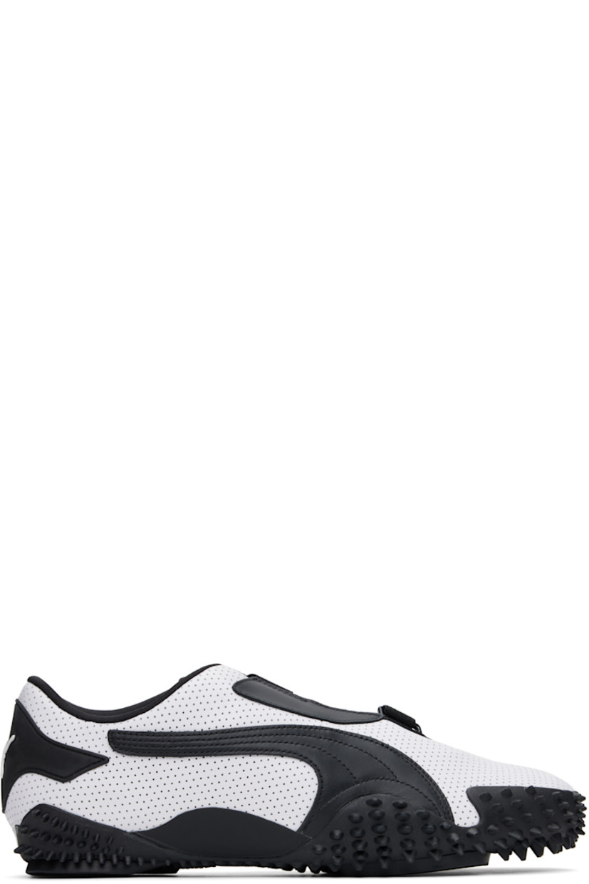 Low-top buffed leather sneakers in white. 

· Perforations throughout
· Offset velcro straps at vamp
· Logo patch at vamp and padded tongue
· Concealed elasticized gusset at tongue
· Padded collar
· Quilted formstrip at outer side
· Rubberized logo patch at heel counter
· Jersey lining
· Spikes at rubber midsole
· Treaded rubber sole

Supplier color: PUMA white/PUMA black