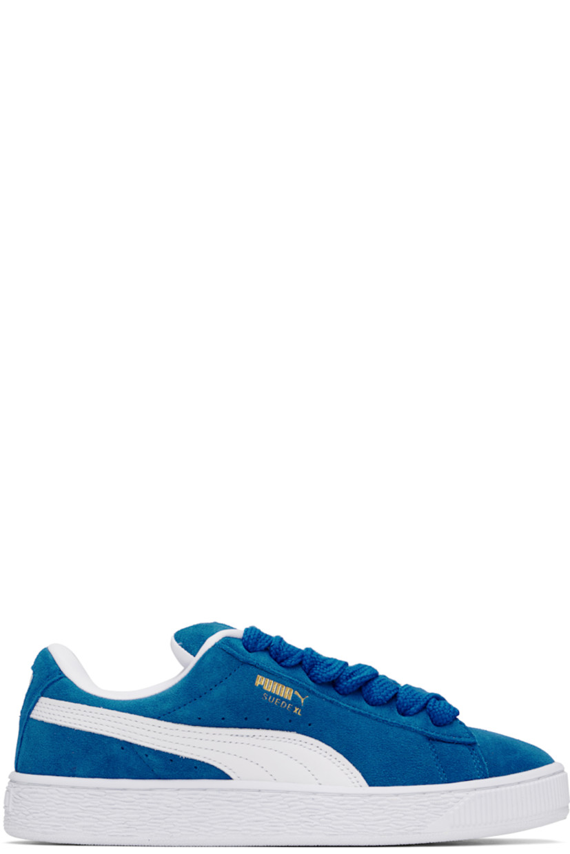 Low-top LWG-certified suede sneakers in blue and white.

· Lace-up closure
· Rubber logo patch at padded tongue
· Padded collar
· Logo stamp at outer side and heel tab
· Formstrip and perforations at sides
· Buffed faux-leather lining
· Logo embossed at textured rubber midsole
· Treaded rubber sole

Supplier color: PUMA team royal/PUMA white