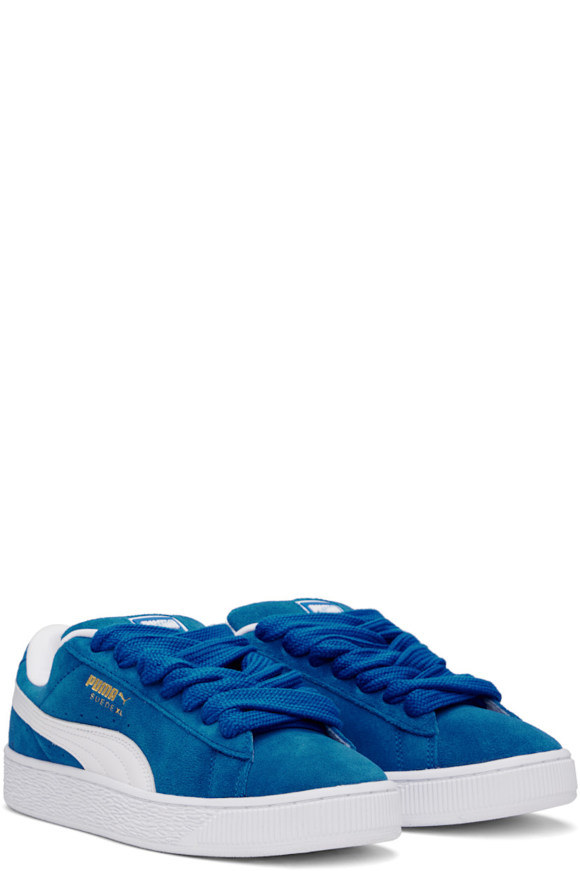 Low-top LWG-certified suede sneakers in blue and white.

· Lace-up closure
· Rubber logo patch at padded tongue
· Padded collar
· Logo stamp at outer side and heel tab
· Formstrip and perforations at sides
· Buffed faux-leather lining
· Logo embossed at textured rubber midsole
· Treaded rubber sole

Supplier color: PUMA team royal/PUMA white