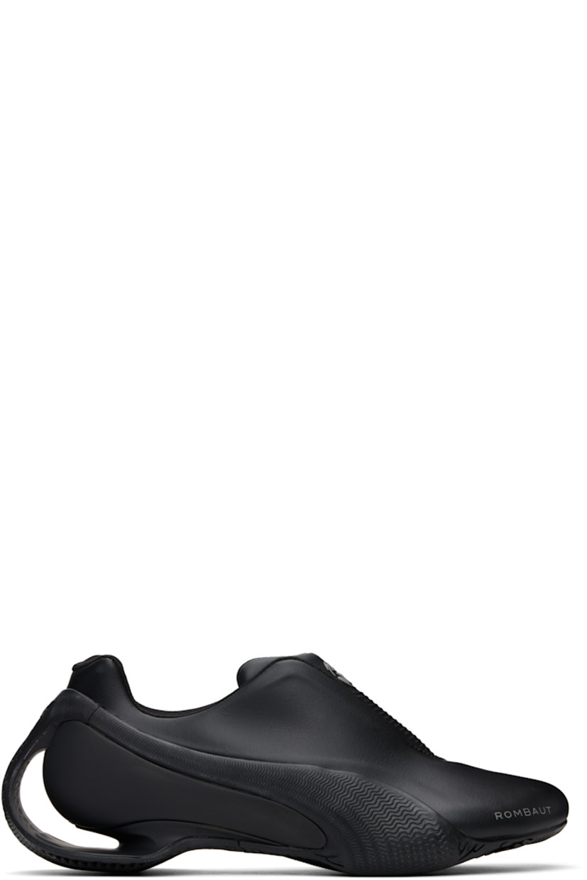Low-top buffed faux-leather slip-on sneakers in black.  

· Logo bonded at toe
· Logo embossed at padded tongue
· Concealed velcro fastenings and elasticized gussets at tongue
· Padded collar
· Textured formstrip at sides
· Logo embossed at heel counter
· Mesh lining
· Sculptural heel with cutout
· Treaded rubber sole

Part of the Puma x Rombaut collaboration. 

Supplier color: Black