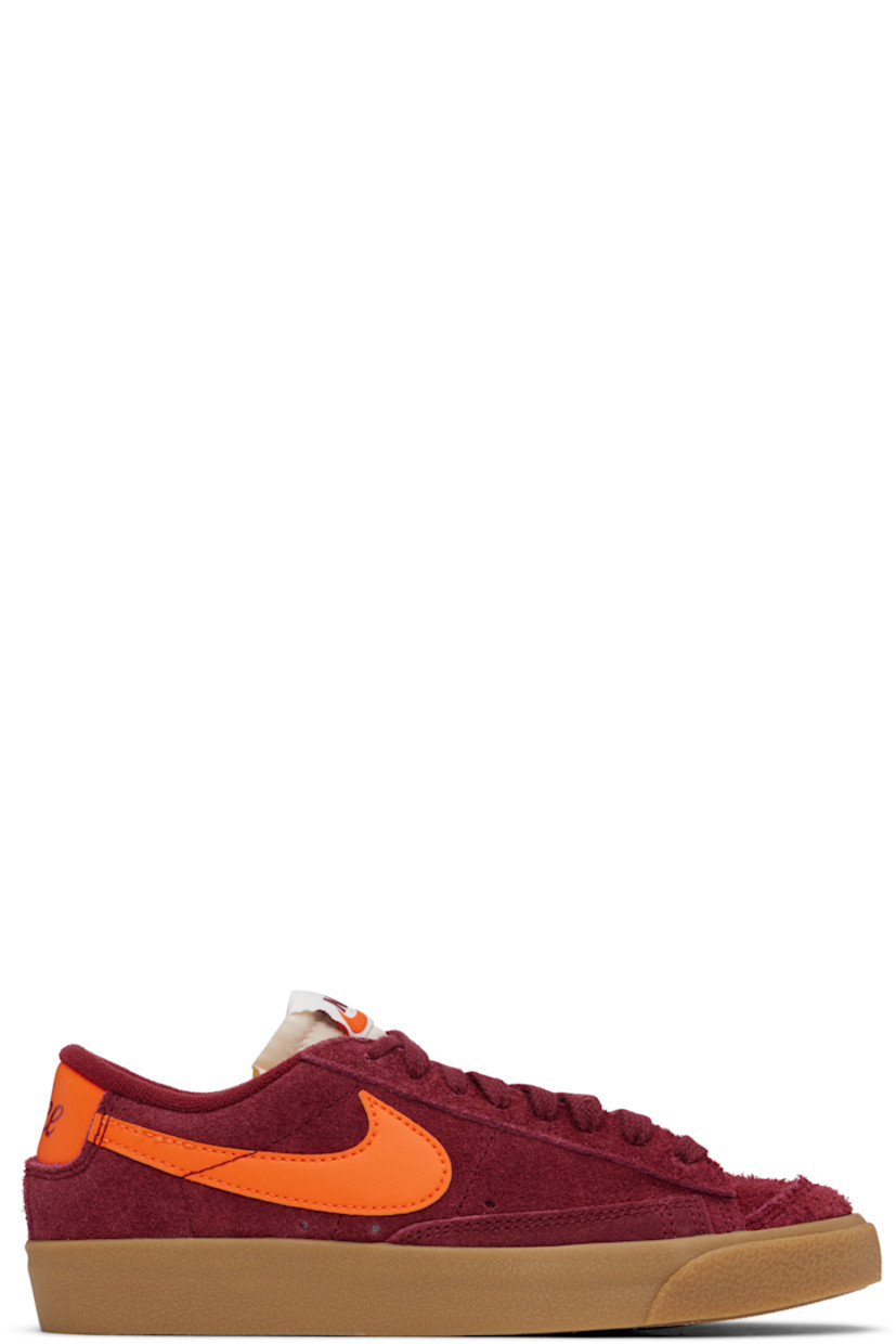 Low-top suede sneakers in burgundy.

· Lace-up closure
· Logo patch at padded tongue
· Padded collar
· Swoosh appliqué at sides
· Perforated detailing at sides
· Logo printed at heel tab
· Terrycloth lining
· Treaded rubber sole

Please note that this item may be shipped only within North America.

Supplier color: Team red/Gum light brown/Team orange/Safety orange
