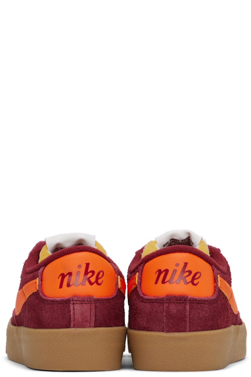 Low-top suede sneakers in burgundy.

· Lace-up closure
· Logo patch at padded tongue
· Padded collar
· Swoosh appliqué at sides
· Perforated detailing at sides
· Logo printed at heel tab
· Terrycloth lining
· Treaded rubber sole

Please note that this item may be shipped only within North America.

Supplier color: Team red/Gum light brown/Team orange/Safety orange