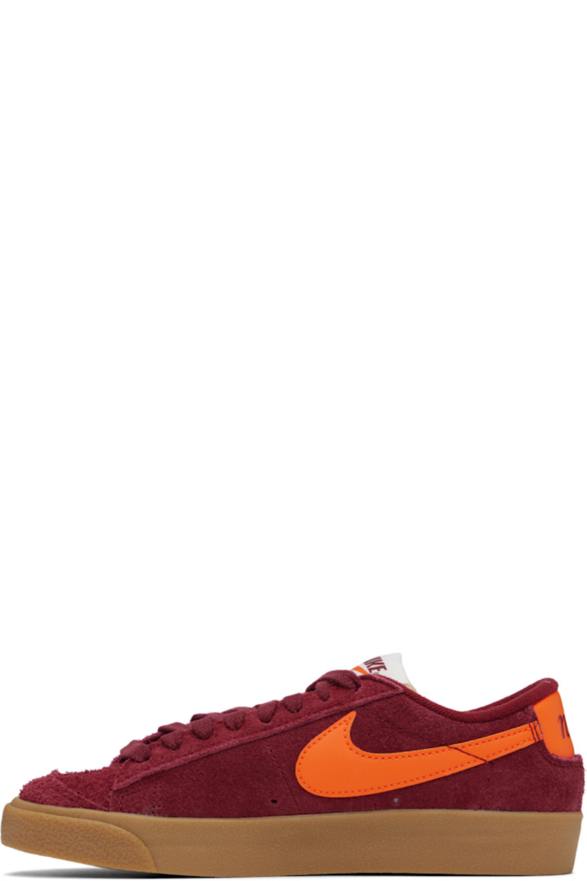 Low-top suede sneakers in burgundy.

· Lace-up closure
· Logo patch at padded tongue
· Padded collar
· Swoosh appliqué at sides
· Perforated detailing at sides
· Logo printed at heel tab
· Terrycloth lining
· Treaded rubber sole

Please note that this item may be shipped only within North America.

Supplier color: Team red/Gum light brown/Team orange/Safety orange