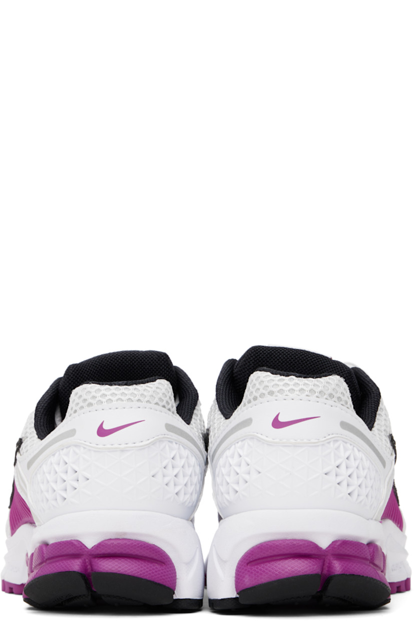Low-top mesh and buffed faux-leather sneakers in white.

· Reflective trim throughout
· Lace-up closure
· Logo patch at padded tongue
· Padded collar
· Rubberized overlay at sides and heel
· Swoosh appliqué at sides
· Swoosh printed at heel tab
· Mesh lining
· Zoom Air cushioning at foam rubber midsole
· Treaded rubber sole

Please note that this item may be shipped only within North America.

Supplier color: White/Mtlc platinum