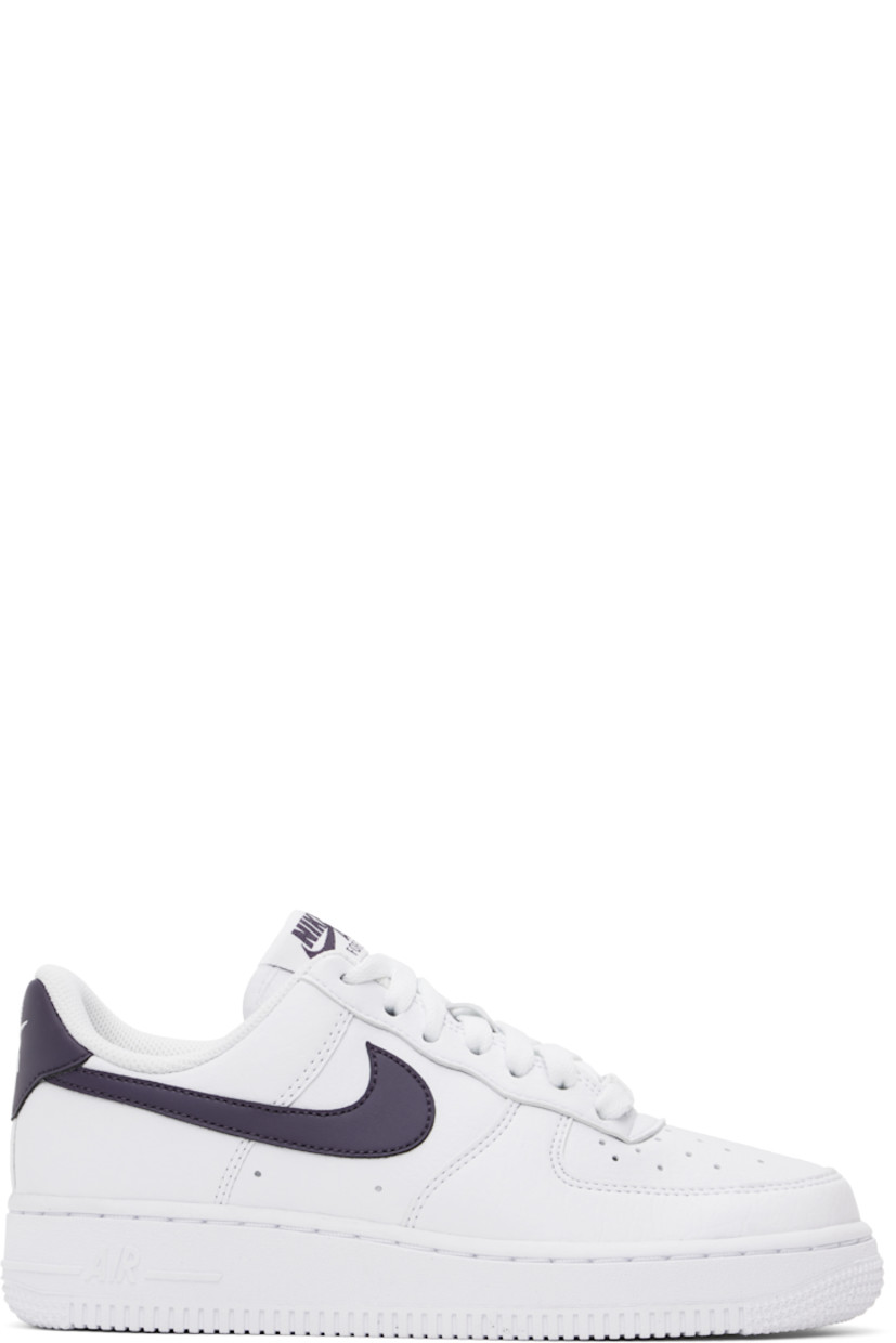 Low-top grained faux-leather sneakers in white and purple.

· Perforations at toe and sides
· Logo plaque at lace-up closure
· Logo patch at padded tongue
· Padded collar
· Swoosh appliqué at sides
· Logo embroidered at heel tab
· Mesh lining
· Nike Air cushioning at foam rubber midsole
· Treaded rubber sole

Please note that this item may be shipped only within North America.

Supplier color: White/Dark raisin