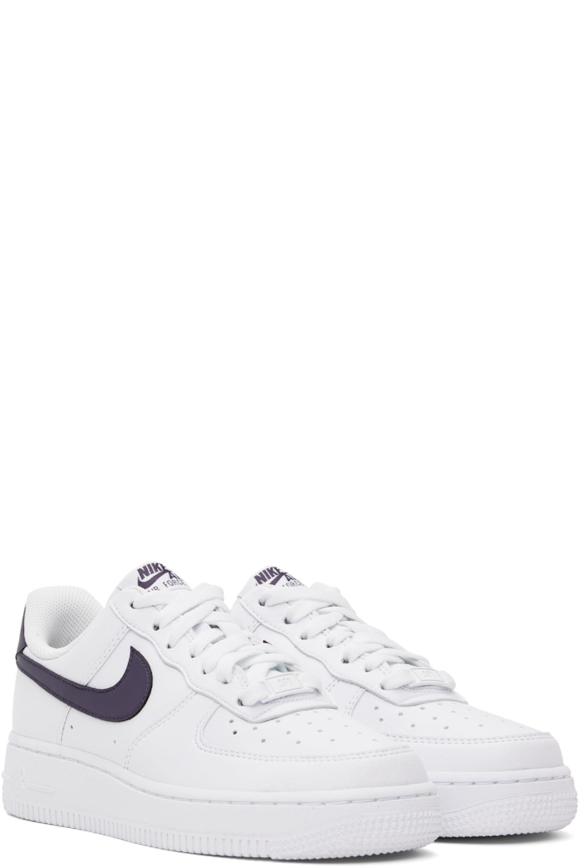 Low-top grained faux-leather sneakers in white and purple.

· Perforations at toe and sides
· Logo plaque at lace-up closure
· Logo patch at padded tongue
· Padded collar
· Swoosh appliqué at sides
· Logo embroidered at heel tab
· Mesh lining
· Nike Air cushioning at foam rubber midsole
· Treaded rubber sole

Please note that this item may be shipped only within North America.

Supplier color: White/Dark raisin