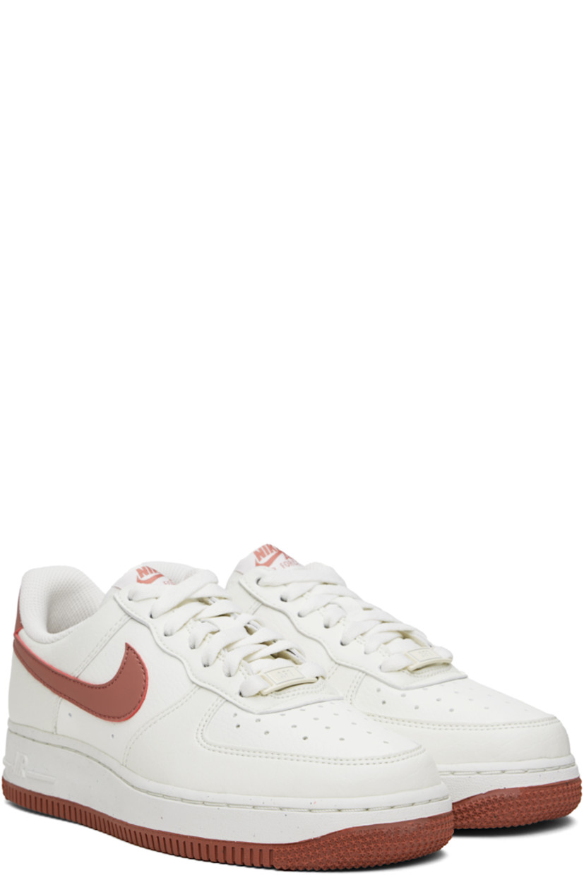 Low-top buffed leather sneakers in white and pink.

· Perforated detailing at toe and sides
· Logo plaque at lace-up closure
· Logo patch at tongue
· Padded collar
· Swoosh appliqué at sides
· Logo embroidered at heel tab
· Mesh lining
· Logo embossed at foam rubber midsole
· Treaded rubber sole

Please note that this item may be shipped only within North America.

Supplier color: Sail/Canyon pink